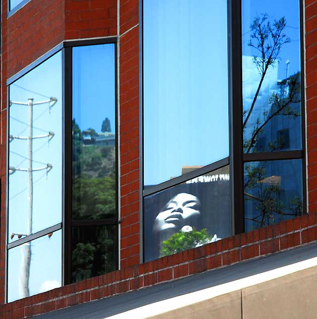 Billboard advertizing perfume, Sunset Strip, West Hollywood - reflected in glass