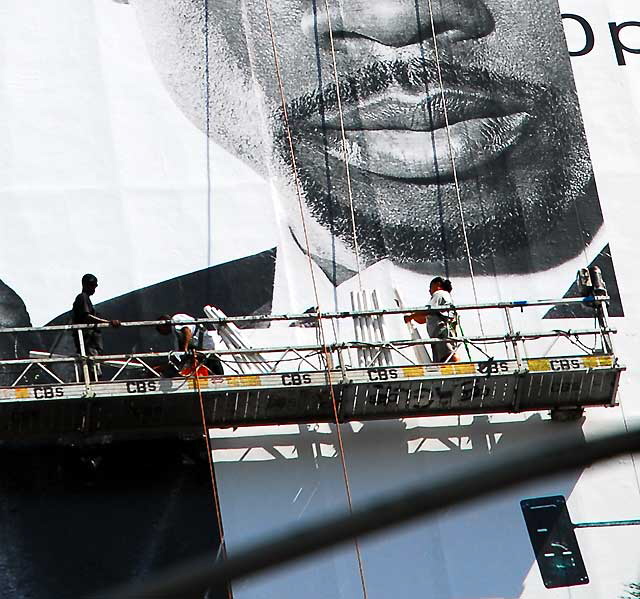 Workers applying building wrap, Sunset Strip, West Hollywood