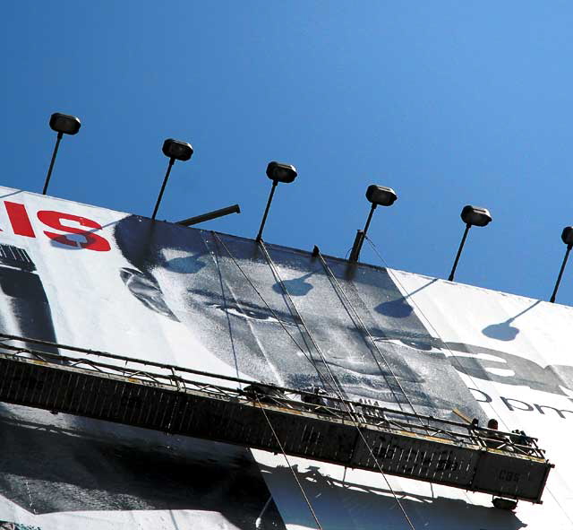 Workers applying building wrap, Sunset Strip, West Hollywood