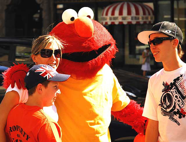 Tourists with Oscar the Grouch, sidewalk in front of the Kodak Theater, Hollywood Boulevard