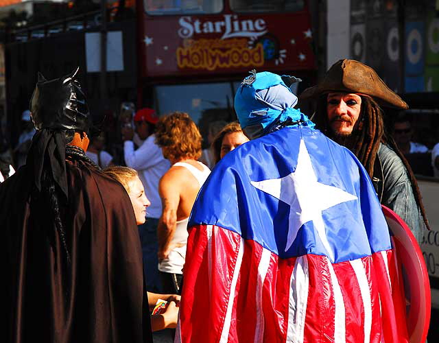 Impersonators in front of Grauman's Chinese Theater, Hollywood Boulevard - Batwoman, Captain America and Captain Jack Sparrow