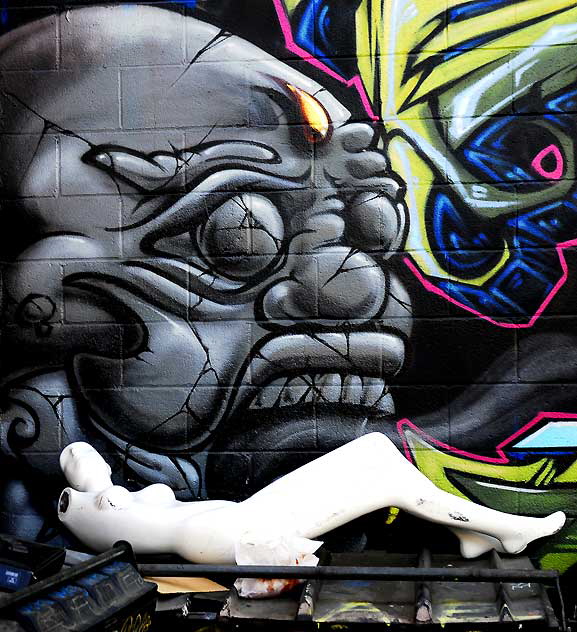 White manikin and skull mural