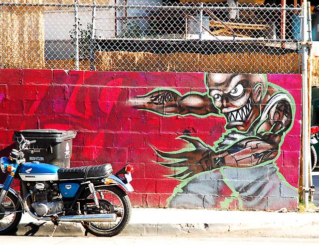Graffiti wall at motorcycle shop, Sunset Boulevard at Vendome Street, in the Silverlake district of Los Angeles