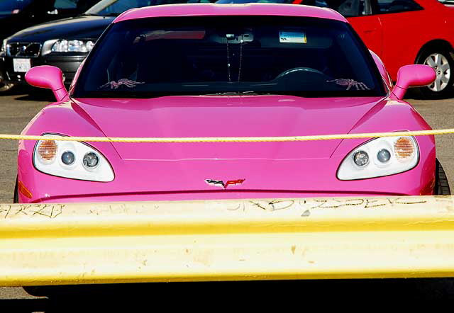 Angelyne's pink Corvette parked in a lot on Las Palmas, behind Central Hollywood