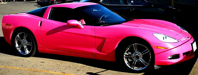 Angelyne's pink Corvette parked in a lot on Las Palmas, behind Central Hollywood