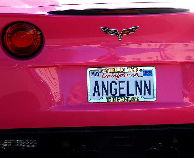 Angelyne's pink Corvette parked in a lot on Las Palmas, behind Central Hollywood