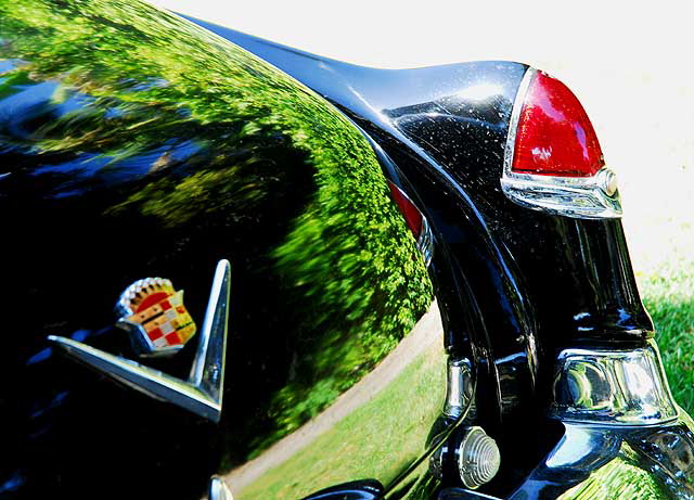 1953 Cadillac sedan, in formal black, parked in the shade not far from Beverly Hills City Hall