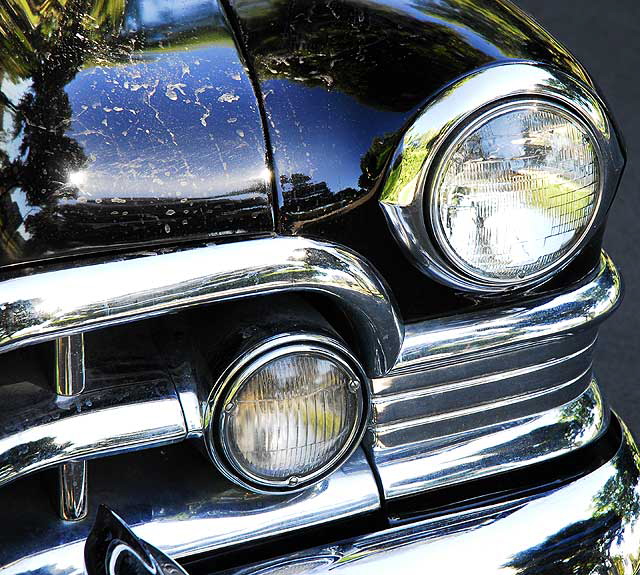 1953 Cadillac sedan, in formal black, parked in the shade not far from Beverly Hills City Hall