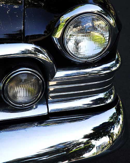 1953 Cadillac sedan, in formal black, parked in the shade not far from Beverly Hills City Hall