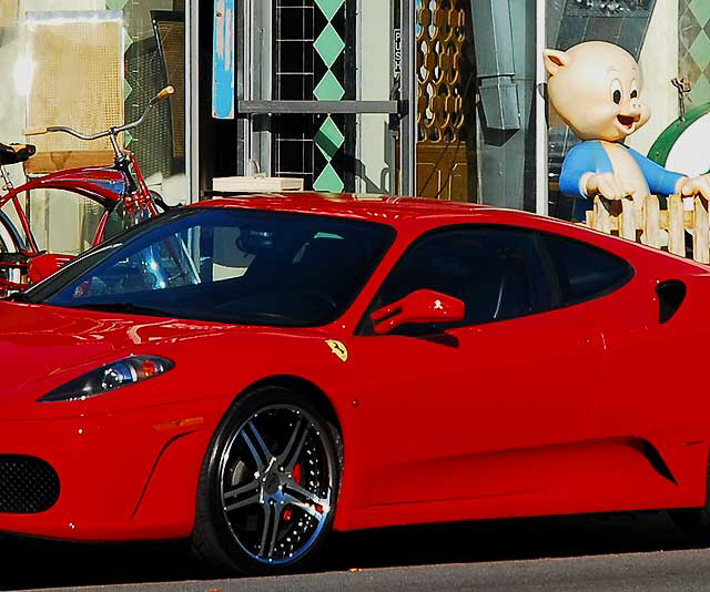 Red Ferrari, antique bicycle and Porky Pig - Melrose Avenue