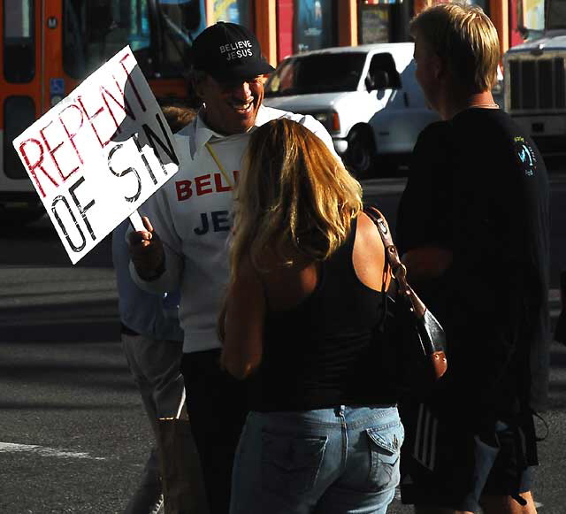 Smiling man with "Repent of Sin" sign, Hollywood Boulevard