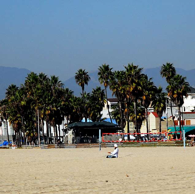 Man in turban in Lotus Position, meditating - Venice Beach