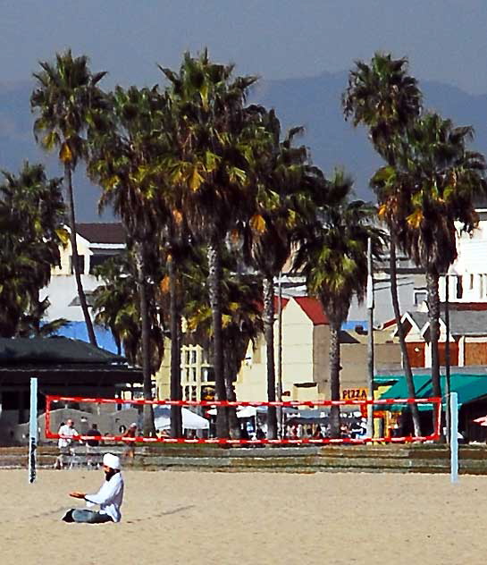 Man in turban in Lotus Position, meditating - Venice Beach