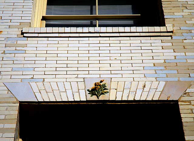 Ceramic rose, white brick wall, Venice Beach