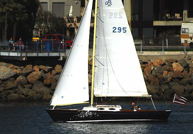 Sailboat exiting Marina Del Rey - Australian flag