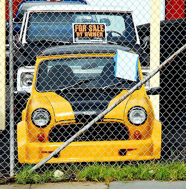 Customized Austin Cooper behind chain link fence, Hollywood