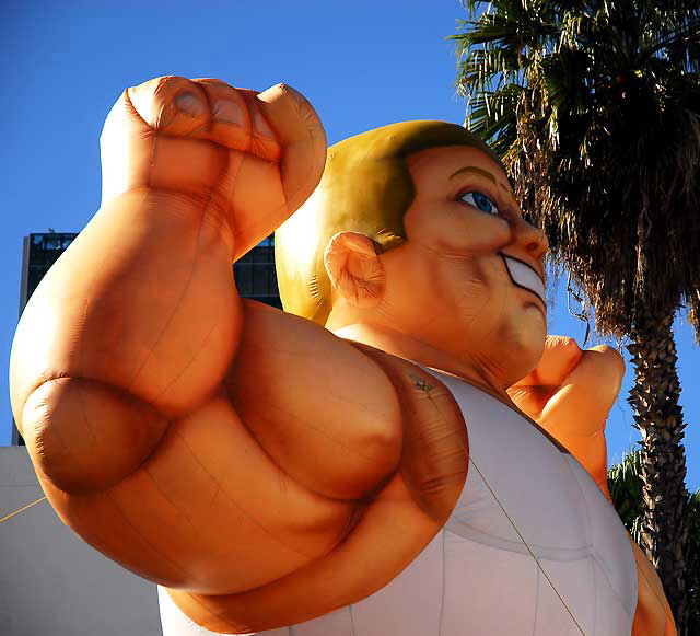 Inflatable muscle man, Sunset Boulevard near Gower