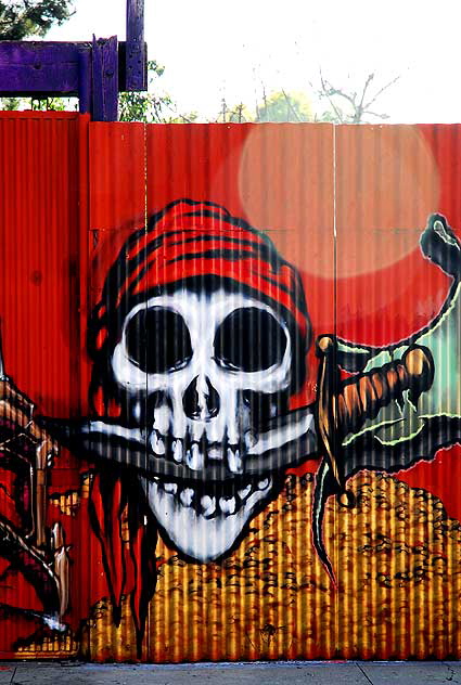Pirate skull with lens flare, graffiti wall, North Hollywood
