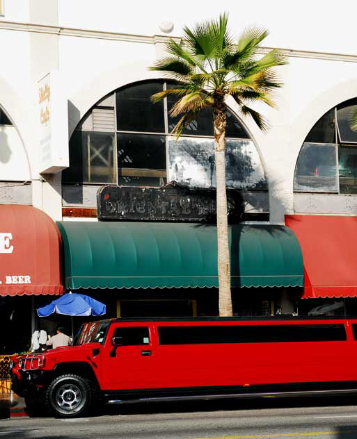 Red Hummer limo and palm tree, Hollywood Boulevard