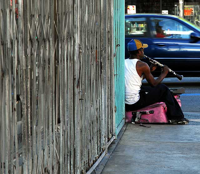 Street musician, clarinet and pink suitcase, Hollywood Boulevard at Cherokee