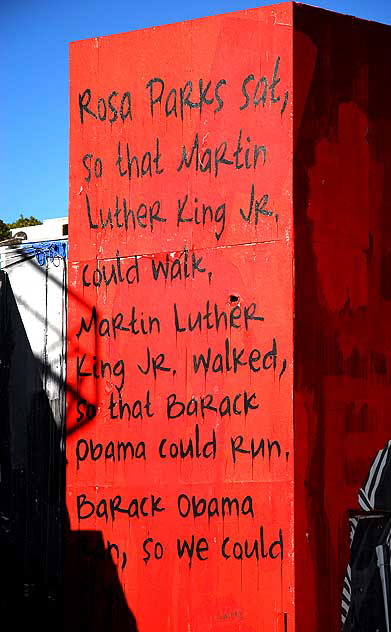Rosa Parks, Martin Luther King and Barack Obama on a red wall on La Brea Boulevard - accompanying text 