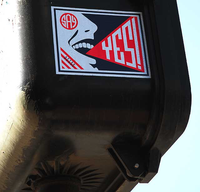 "Say Yes" sticker on traffic signal, 5500 Wilshire Boulevard, Los Angeles