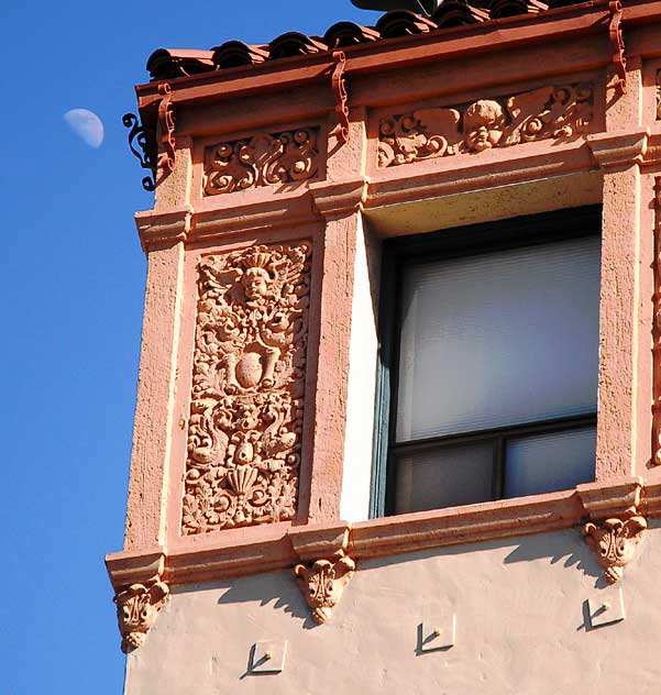 Moon in daytime sky over Colonial Revival apartment building on Wilshire Boulevard, Los Angeles