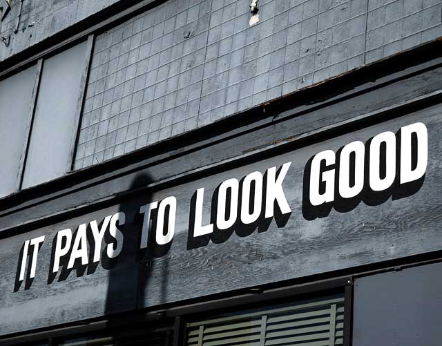 "It Pays to Look Good" - sign at old barbershop, Sunset Junction
