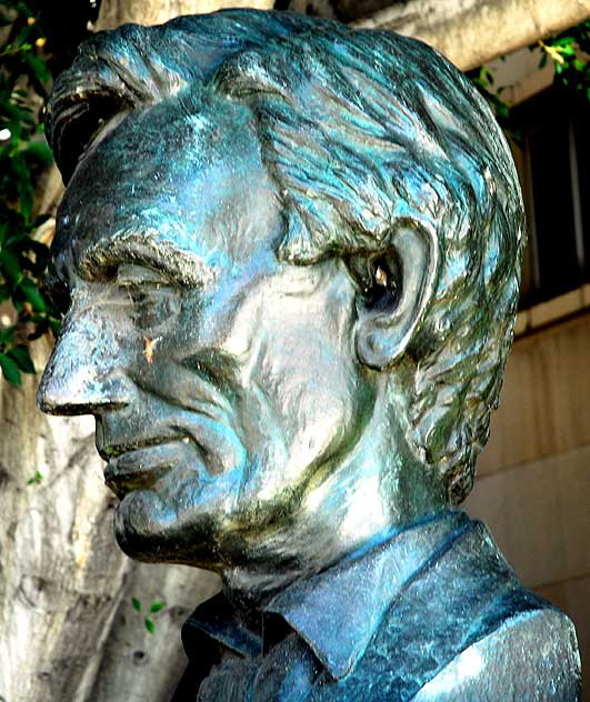 The bust of Lincoln sits quietly in the shade on his two-hundredth birthday, downtown at the Federal courthouse in Los Angeles
