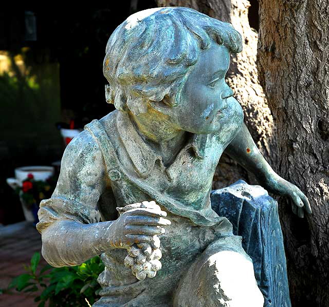 Bronze figure in beach garden, Westwind Avenue on the Marina Peninsula