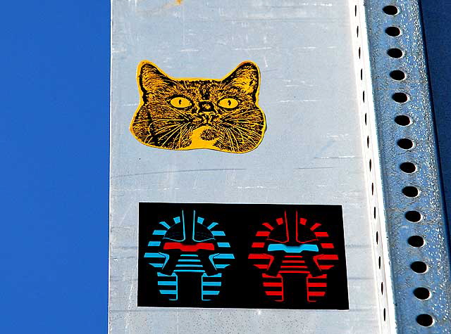 Cat sticker on street sign