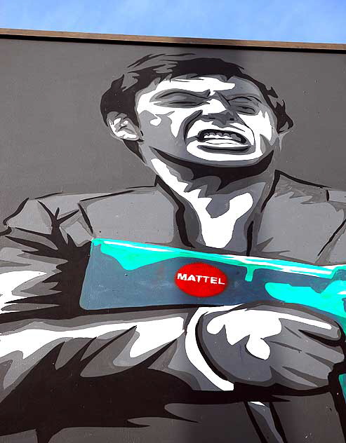 Mattel - man with gun - graphic at Sunset and Gower