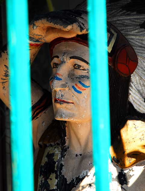 Wooden Indian behind turquoise bars, Melrose Avenue, near Western