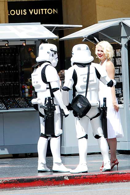 Marilyn Monroe chats with two storm troopers from Star Wars - impersonators on Hollywood Boulevard 