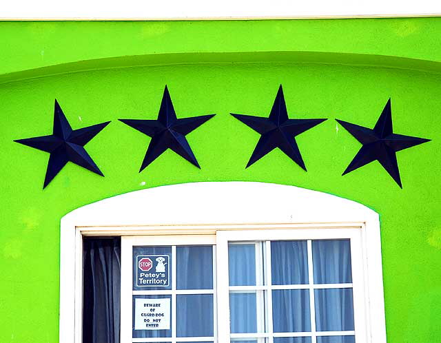 Black stars on green wall, Ocean Front Walk, Venice Beach