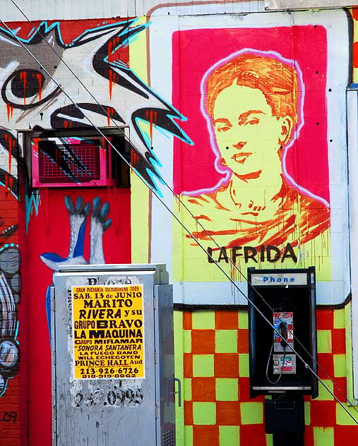 At the corner of Melrose Avenue and Wilton Place, a mural, an homage to Frida Kahlo
