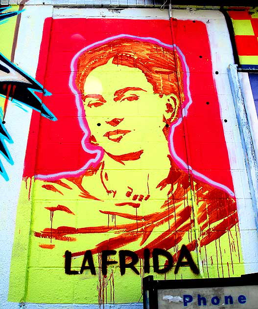 At the corner of Melrose Avenue and Wilton Place, a mural, an homage to Frida Kahlo