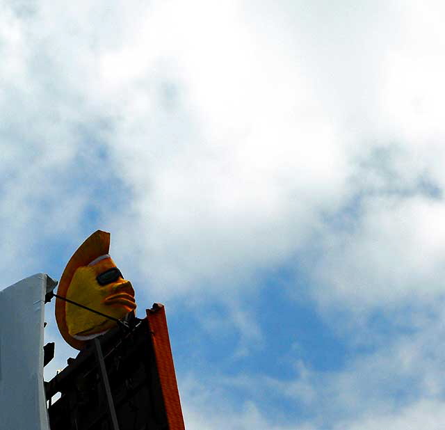 Three dimensional face above beer billboard, Hollywood Boulevard