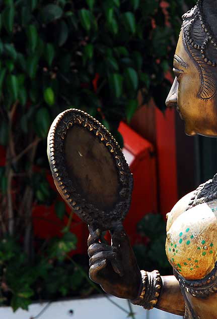Woman and Mirror, gold Indian figure on display at antique shop on Sunset Boulevard 