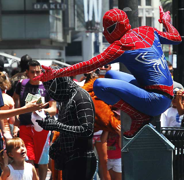 Impersonators in front of the Chinese Theater on Hollywood Boulevard - good and bad Spiderman