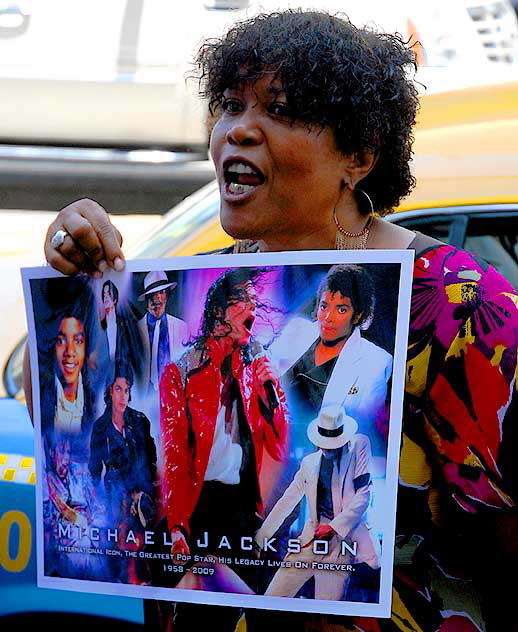 The scene on Hollywood Boulevard on Friday, June 26, 2009 - the day after the death of Michael Jackson - fan with photo