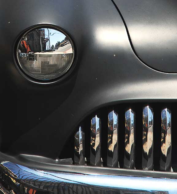 Highly customized flat-black chopped and channeled '51 Mercury parked at a body shop next to a tattoo parlor on Melrose Avenue a few feet east of Cahuenga Boulevard, just south of Hollywood 