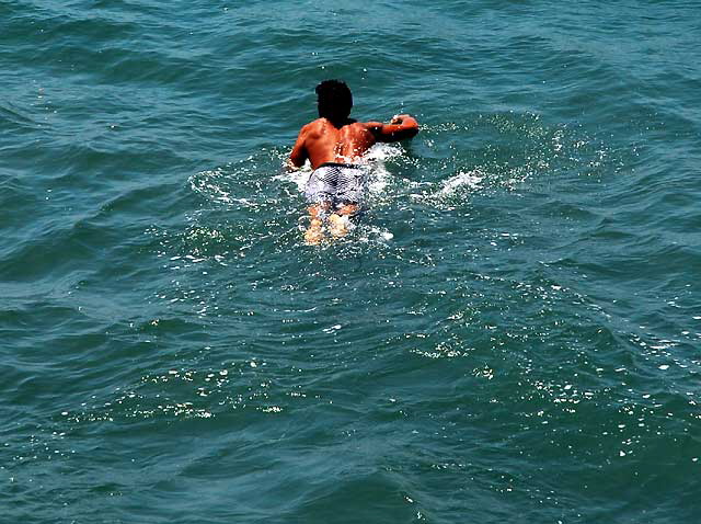 Surfer at the Venice Beach Pier, Wednesday, July 22, 2009