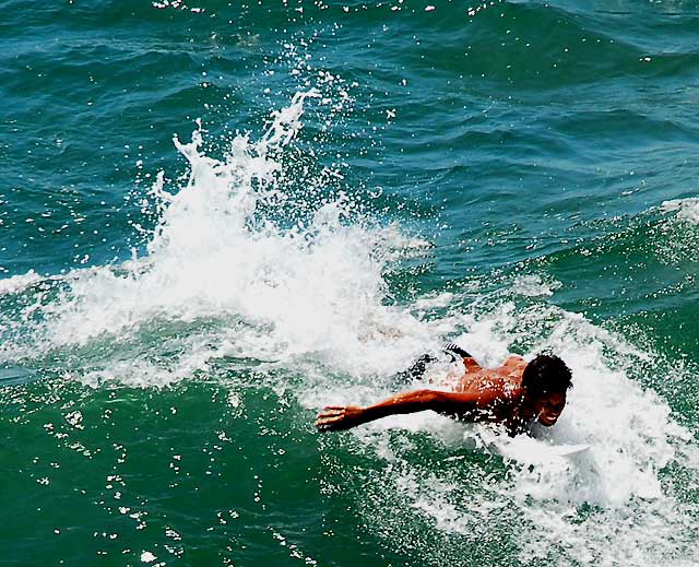 Surfer at the Venice Beach Pier, Wednesday, July 22, 2009