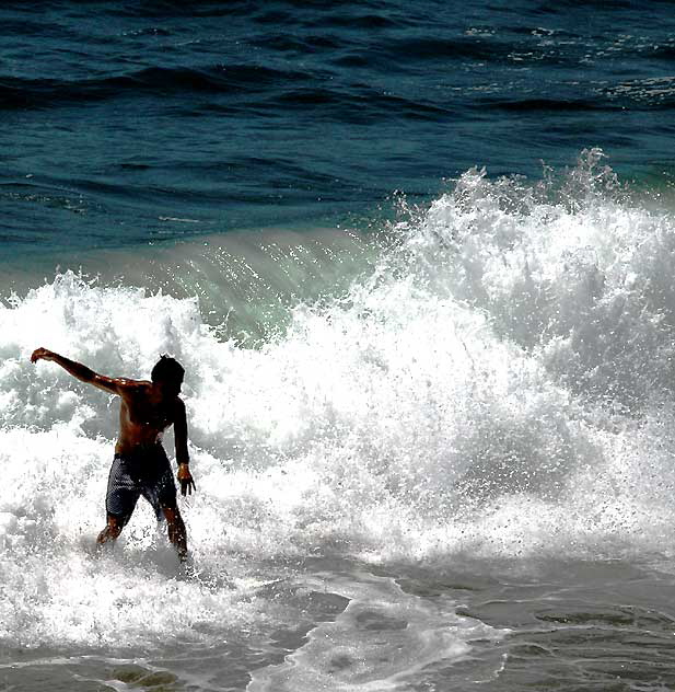 Surfer at the Venice Beach Pier, Wednesday, July 22, 2009