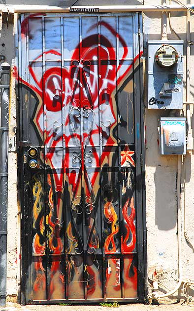 Graffiti door, alley behind Melrose Avenue - skull and flames