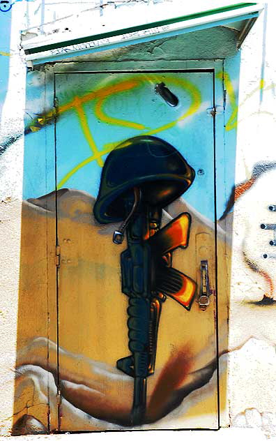 Graffiti door, alley behind Melrose Avenue - gun and helmet