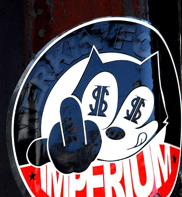 Dollar Sign Cat Giving You the Finger, sticker on La Brea, Los Angeles