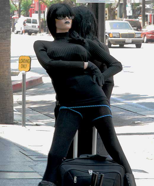 Man in black with his mannequin on Hollywood Boulevard 