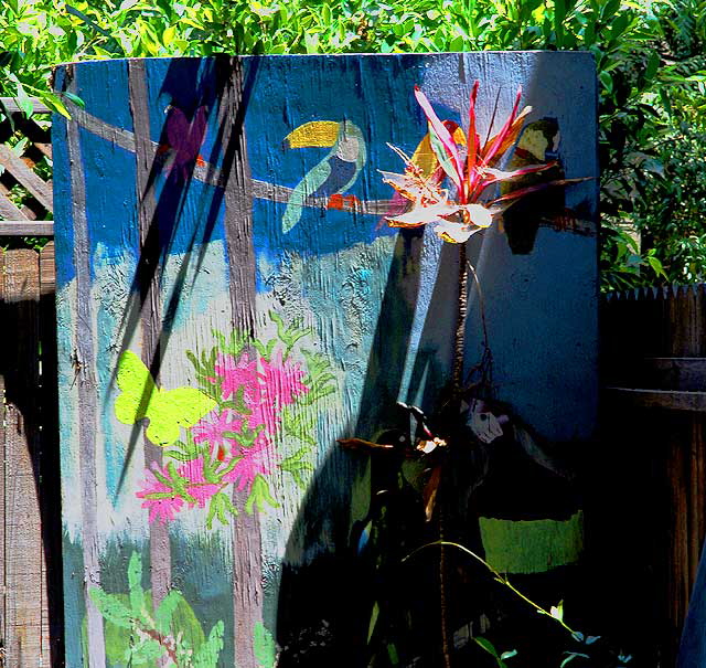 Bird painting in the garden of an old bungalow on Hudson, a few feet north of Hollywood Boulevard